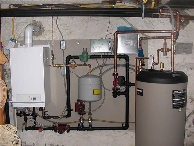 Mechanical room build with boiler, controls, and zoned manifold.
