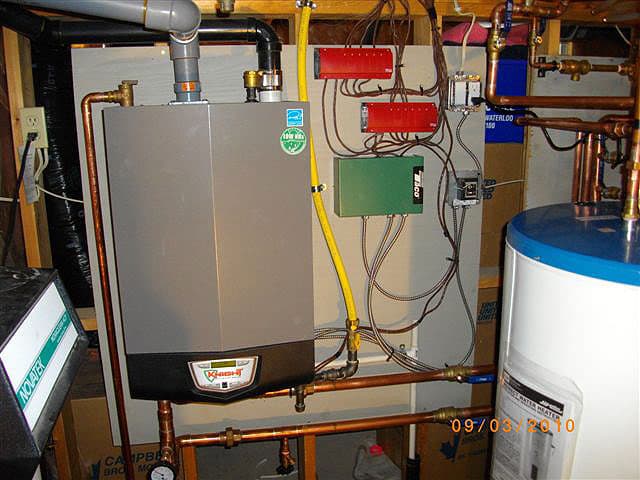Plumbing rough-in with boiler and indirect tank for a Waterloo home.